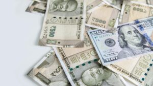 Rupee rises 6 paise to close at 94.34 against U.S. dollar